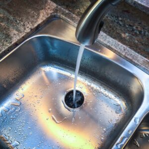 water running in a kitchen sink